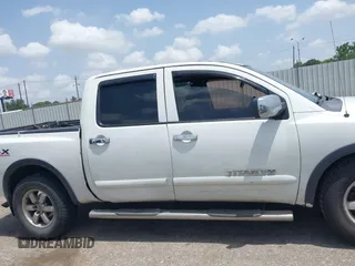 2012 Nissan Titan SL with VIN 1N6BA0EC1CN326919, listed as a IAAI auction lot 42630368 with 230,215 mi miles and . Bid and sale history available at DreamBid. Image 13.