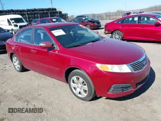 2009 Kia Optima LX with VIN KNAGE228X95314931, listed as a IAAI auction lot 41890304 with 217,901 mi miles. Bid and sale history available at carsss.com. Image 1.