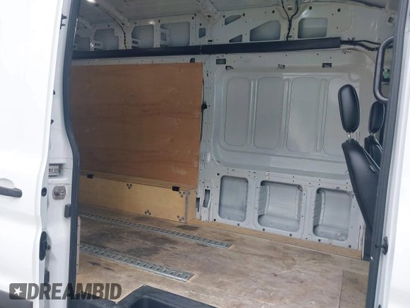 2020 Ford Transit Cargo with VIN 1FTBW3XG0LKB42773, listed as a IAAI auction lot 41564980 with 57,124 mi miles and . Bid and sale history available at carsss.com. Image 8.