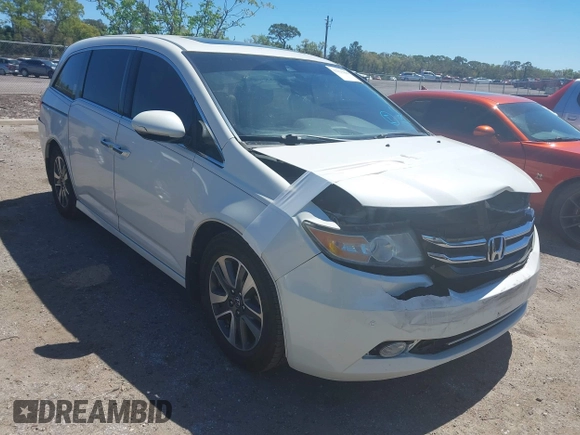 2015 Honda Odyssey Touring Elite with VIN 5FNRL5H96FB090702, listed as a IAAI auction lot 41825889 with 118,157 mi miles and . Bid and sale history available at DreamBid. Image 1.