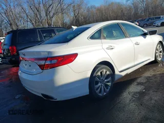 2014 Hyundai Azera with VIN KMHFG4JG6EA354949, listed as a IAAI auction lot 41034372 with 173,338 mi miles and . Bid and sale history available at DreamBid. Image 4.
