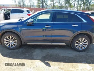 2019 Cadillac XT4 FWD Premium Luxury z VIN 1GYFZCR47KF109394, wystawiony jako IAAI lot #41864606 z przebiegiem 98 425 mil mil oraz . Historia ofert i sprzedaży dostępna na DreamBid. Obrazek 14.