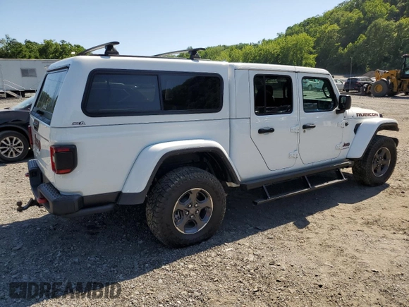 2023 Jeep Gladiator Rubicon with VIN 1C6JJTBG9PL546437, listed as a Copart auction lot 62536575 with 14,106 mi miles and Salvage title. Bid and sale history available at DreamBid. Image 3.