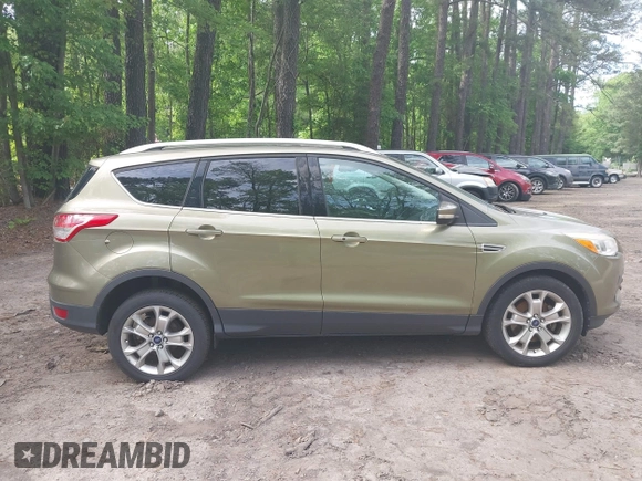 2014 Ford Escape Titanium with VIN 1FMCU9JX9EUB23972, listed as a IAAI auction lot 42217298 with 164,556 mi miles and . Bid and sale history available at DreamBid. Image 13.
