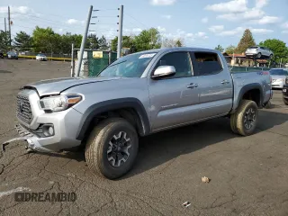 2021 Toyota Tacoma SR with VIN 5TFCZ5AN4MX268962, listed as a Copart auction lot 58923735 with 60,646 mi miles and Salvage title. Bid and sale history available at DreamBid. Image 1.