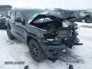 2018 Jeep Grand Cherokee Laredo E with VIN 1C4RJFAG0JC203148, listed as a IAAI auction lot 41614678 with 118,500 mi miles. Bid and sale history available at carsss.com. Image 1.