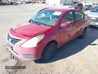 2015 Nissan Versa SV with VIN 3N1CN7APXFL906108, listed as a IAAI auction lot 41674926 with 135,613 mi miles. Bid and sale history available at carsss.com. Image 2.