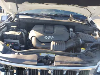 2012 Jeep Grand Cherokee Laredo with VIN 1C4RJFAG5CC310893, listed as a IAAI auction lot 41695279 with 136,821 mi miles. Bid and sale history available at carsss.com. Image 10.