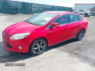 2013 Ford Focus SE z VIN 1FADP3F27DL227588, wystawiony jako IAAI lot #42210560 z przebiegiem 248 185 mil mil oraz . Historia ofert i sprzedaży dostępna na DreamBid. Obrazek 2.