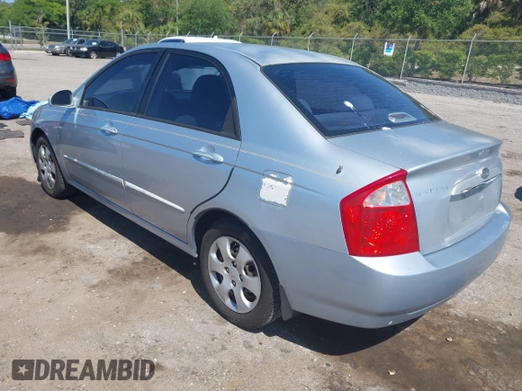 2005 Kia Spectra LX with VIN KNAFE121955107403, listed as a IAAI auction lot 42055036 with 157,605 mi miles. Bid and sale history available at carsss.com. Image 3.