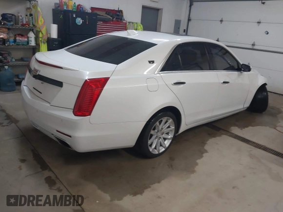 2015 Cadillac CTS Luxury AWD with VIN 1G6AX5SX5F0117267, listed as a IAAI auction lot 41762217 with 79,930 mi miles and . Bid and sale history available at DreamBid. Image 4.