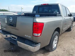 2007 Nissan Titan SE with VIN 1N6BA07A77N233436, listed as a IAAI auction lot 42562943 with 252,076 mi miles and . Bid and sale history available at DreamBid. Image 4.