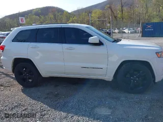 2015 Jeep Grand Cherokee Altitude with VIN 1C4RJFAG1FC797157, listed as a IAAI auction lot 42021139 with 148,491 mi miles. Bid and sale history available at carsss.com. Image 13.