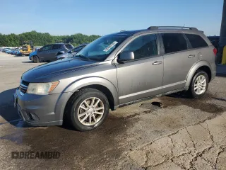 2013 Dodge Journey SXT with VIN 3C4PDCBG0DT522408, listed as a Copart auction lot 62699195 with 130,665 mi miles and Salvage title. Bid and sale history available at DreamBid. Image 1.