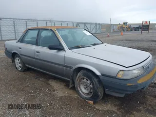 1990 Toyota Camry DLX z VIN 4T1SV21EXLU271320, wystawiony jako IAAI lot #41798353 z przebiegiem 269 178 mil mil oraz . Historia ofert i sprzedaży dostępna na DreamBid. Obrazek 1.