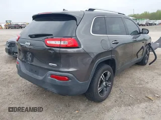 2015 Jeep Cherokee Latitude with VIN 1C4PJLCB0FW601862, listed as a IAAI auction lot 41931048 with 100,705 mi miles and . Bid and sale history available at DreamBid. Image 4.