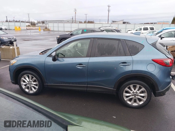 2015 Mazda CX-5 Grand Touring with VIN JM3KE4DY0F0493969, listed as a IAAI auction lot 41581885 with 71,014 mi miles. Bid and sale history available at carsss.com. Image 15.
