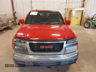 2011 GMC Canyon z VIN 1GTJ6NFE1B8109333, wystawiony jako IAAI lot #42035352 z przebiegiem 135 403 mil mil oraz . Historia ofert i sprzedaży dostępna na DreamBid. Obrazek 12.