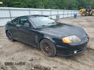 2003 Hyundai Tiburon GT z VIN KMHHN65F83U101784, wystawiony jako Copart lot #41566805 z przebiegiem 99 970 mil mil oraz Nie do naprawy • Non repairable. Historia ofert i sprzedaży dostępna na DreamBid. Obrazek 4.