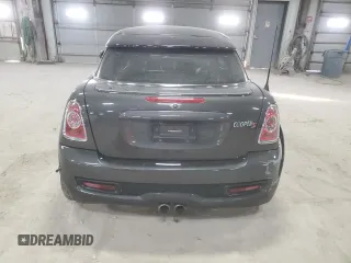 2012 MINI Coupe S z VIN WMWSX3C51CT408195, wystawiony jako Copart lot #77008744 z przebiegiem Nie podano mil oraz Szkody całkowita. Historia ofert i sprzedaży dostępna na DreamBid. Obrazek 6.