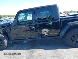2021 Jeep Gladiator Willys with VIN 1C6HJTAGXML613431, listed as a IAAI auction lot 42180502 with 64,572 mi miles and . Bid and sale history available at DreamBid. Image 17.