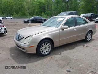 2003 Mercedes-Benz E-Class 3.2L with VIN WDBUF65J23A243178, listed as a IAAI auction lot 41974660 with 134,459 mi miles. Bid and sale history available at carsss.com. Image 2.