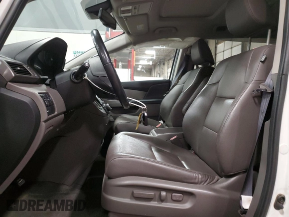 2016 Honda Odyssey EX-L with VIN 5FNRL5H67GB090747, listed as a Copart auction lot 53957235 with 131,464 mi miles and Salvage Title. Bid and sale history available at DreamBid. Image 7.