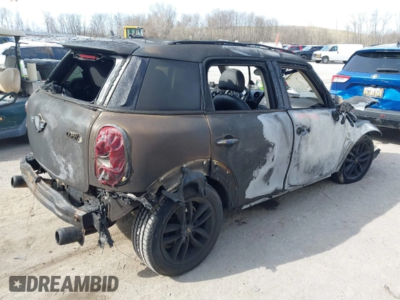 2014 MINI Countryman S with VIN WMWZC3C55EWT00416, listed as a IAAI auction lot 42031870 with Not Provided miles and . Bid and sale history available at DreamBid. Image 4.