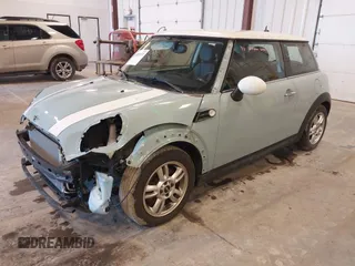 2013 MINI Cooper Hardtop with VIN WMWSU3C56DT373471, listed as a IAAI auction lot 41851137 with 52,825 mi miles. Bid and sale history available at carsss.com. Image 2.