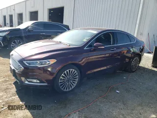 2017 Ford Fusion SE z VIN 3FA6P0H94HR347082, wystawiony jako Copart lot #55826755 z przebiegiem 92 241 mil mil oraz Czysty tytuł • Clean title. Historia ofert i sprzedaży dostępna na DreamBid. Obrazek 1.
