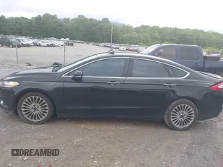2016 Ford Fusion Titanium with VIN 3FA6P0K97GR118922, listed as a IAAI auction lot 42121212 with 256,584 mi miles and . Bid and sale history available at DreamBid. Image 14.