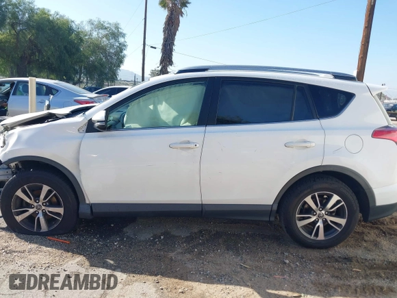 2017 Toyota RAV4 XLE with VIN JTMWFREV9HJ128521, listed as a IAAI auction lot 41658054 with 106,788 mi miles and . Bid and sale history available at DreamBid. Image 14.