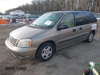 2005 Ford Freestar SE z VIN 2FMZA51645BA05742, wystawiony jako IAAI lot #41429194 z przebiegiem 145 415 mil mil oraz . Historia ofert i sprzedaży dostępna na DreamBid. Obrazek 2.