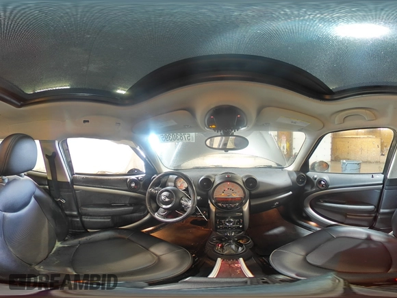 2014 MINI Countryman with VIN WMWZB3C59EWR42124, listed as a Copart auction lot 57830395 with 125,000 mi miles and Salvage title. Bid and sale history available at DreamBid. Image 16.