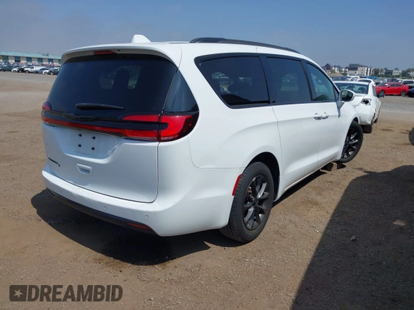 2021 Chrysler Pacifica Touring with VIN 2C4RC1FG7MR605587, listed as a IAAI auction lot 42329028 with 111,305 mi miles and . Bid and sale history available at DreamBid. Image 4.