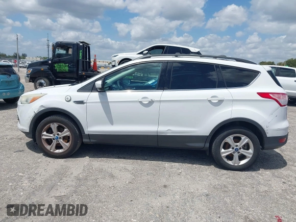 2013 Ford Escape SE with VIN 1FMCU0GX0DUC79223, listed as a IAAI auction lot 42077240 with 158,141 mi miles and . Bid and sale history available at DreamBid. Image 14.