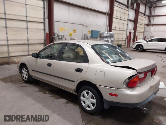 1998 Mazda Protege DX z VIN JM1BC1419W0171802, wystawiony jako IAAI lot #42202861 z przebiegiem 252 304 mil mil oraz . Historia ofert i sprzedaży dostępna na DreamBid. Obrazek 3.