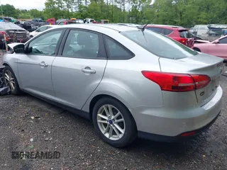 2016 Ford Focus SE z VIN 1FADP3F29GL353908, wystawiony jako IAAI lot #42289308 z przebiegiem 94 937 mil mil oraz . Historia ofert i sprzedaży dostępna na DreamBid. Obrazek 3.