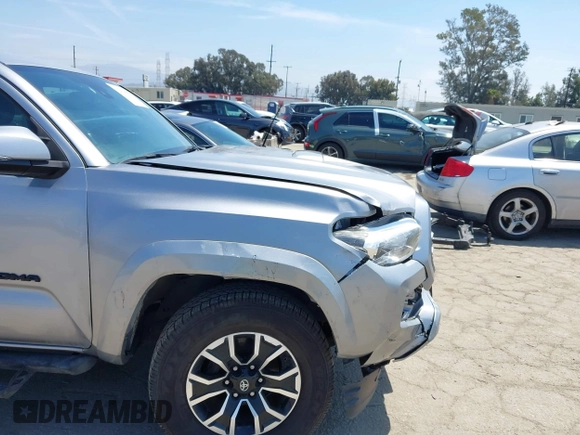 2021 Toyota Tacoma SR with VIN 3TMCZ5AN6MM393306, listed as a IAAI auction lot 42094095 with 57,217 mi miles and . Bid and sale history available at DreamBid. Image 6.