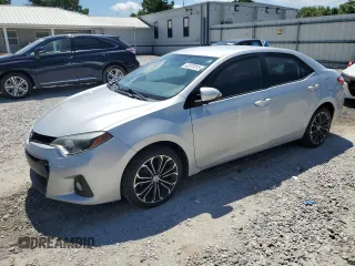 2014 Toyota Corolla L with VIN 5YFBURHEXEP143181, listed as a Copart auction lot 62073815 with 156,829 mi miles and Salvage title. Bid and sale history available at DreamBid. Image 1.