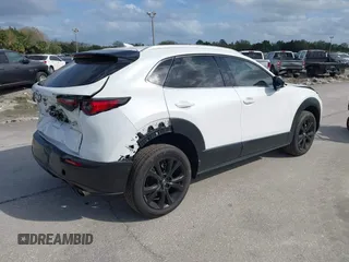 2022 Mazda CX-30 2.5 Turbo Premium Package with VIN 3MVDMBDY3NM437897, listed as a IAAI auction lot 41715776 with 42,771 mi miles. Bid and sale history available at carsss.com. Image 4.