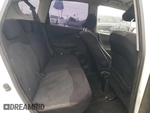 2009 Honda Fit Sport with VIN JHMGE88409S066991, listed as a Copart auction lot 52823425 with 275,722 mi miles and Salvage Title. Bid and sale history available at carsss.com. Image 11.