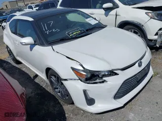 2015 Scion tC with VIN JTKJF5C79F3092380, listed as a IAAI auction lot 41906108 with 155,449 mi miles. Bid and sale history available at carsss.com. Image 1.