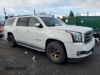 2015 GMC Yukon XL SLT with VIN 1GKS2HKC0FR220823, listed as a Copart auction lot 42155185 with 199,385 mi miles and Salvage Title. Bid and sale history available at carsss.com. Image 4.