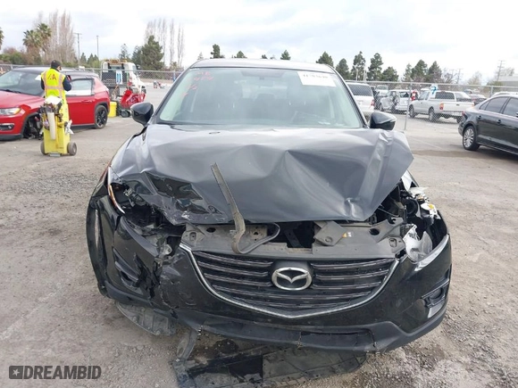 2016 Mazda CX-5 Touring with VIN JM3KE2CY7G0893101, listed as a IAAI auction lot 41783640 with NaN miles. Bid and sale history available at carsss.com. Image 6.