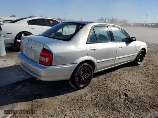 2001 Mazda Protege DX with VIN JM1BJ222210417508, listed as a Copart auction lot 83482064 with 0 mi miles and Salvage Title. Bid and sale history available at carsss.com. Image 3.