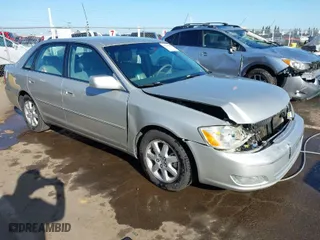 2001 Toyota Avalon XL w/Bucket Seats with VIN 4T1BF28B51U189775, listed as a IAAI auction lot 41970356 with 247,969 mi miles. Bid and sale history available at carsss.com. Image 1.