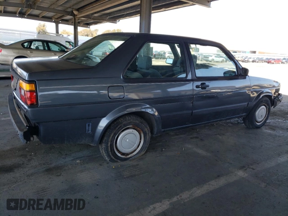 1989 Volkswagen Jetta z VIN WVWKB01G2KW684385, wystawiony jako Copart lot #49694065 z przebiegiem 63 792 mil mil oraz Czysty tytuł • Clean title. Historia ofert i sprzedaży dostępna na DreamBid. Obrazek 3.
