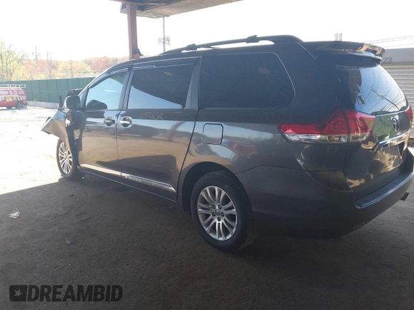 2014 Toyota Sienna XLE with VIN 5TDYK3DC5ES433949, listed as a IAAI auction lot 42095625 with 337,642 mi miles and . Bid and sale history available at DreamBid. Image 3.