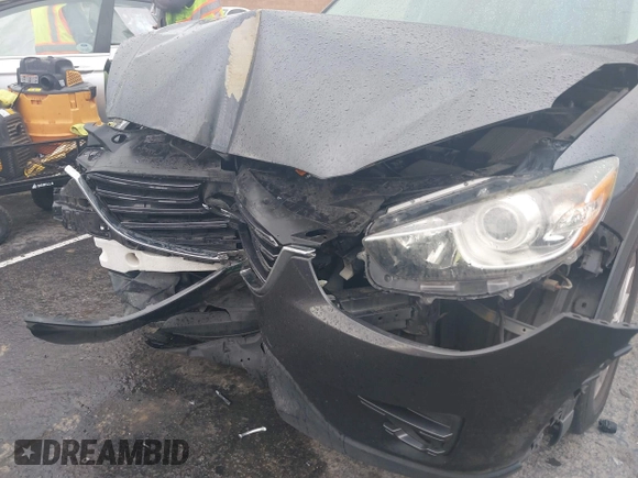 2016 Mazda CX-5 Touring with VIN JM3KE2CY7G0630056, listed as a IAAI auction lot 41817525 with 97,844 mi miles and . Bid and sale history available at DreamBid. Image 6.